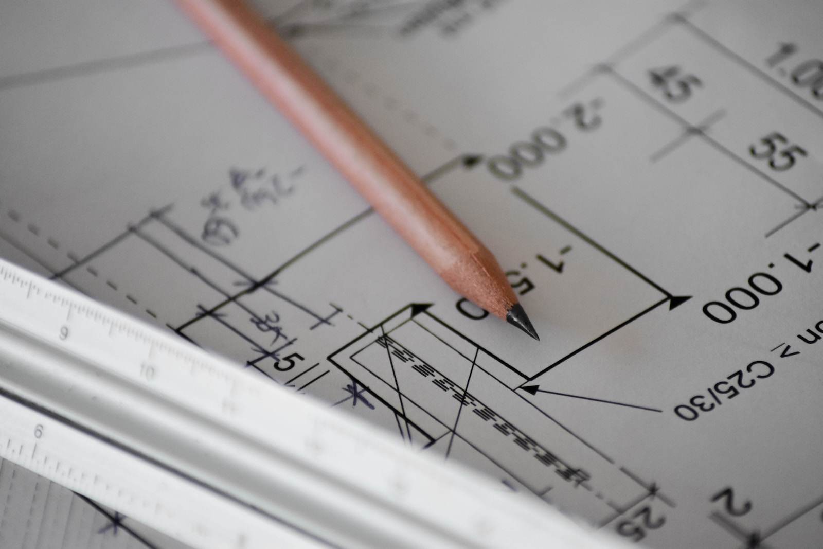 Lazarus Renovation | Complete Floor Plans. An Image of a pencil on a hand drawn floor plan.