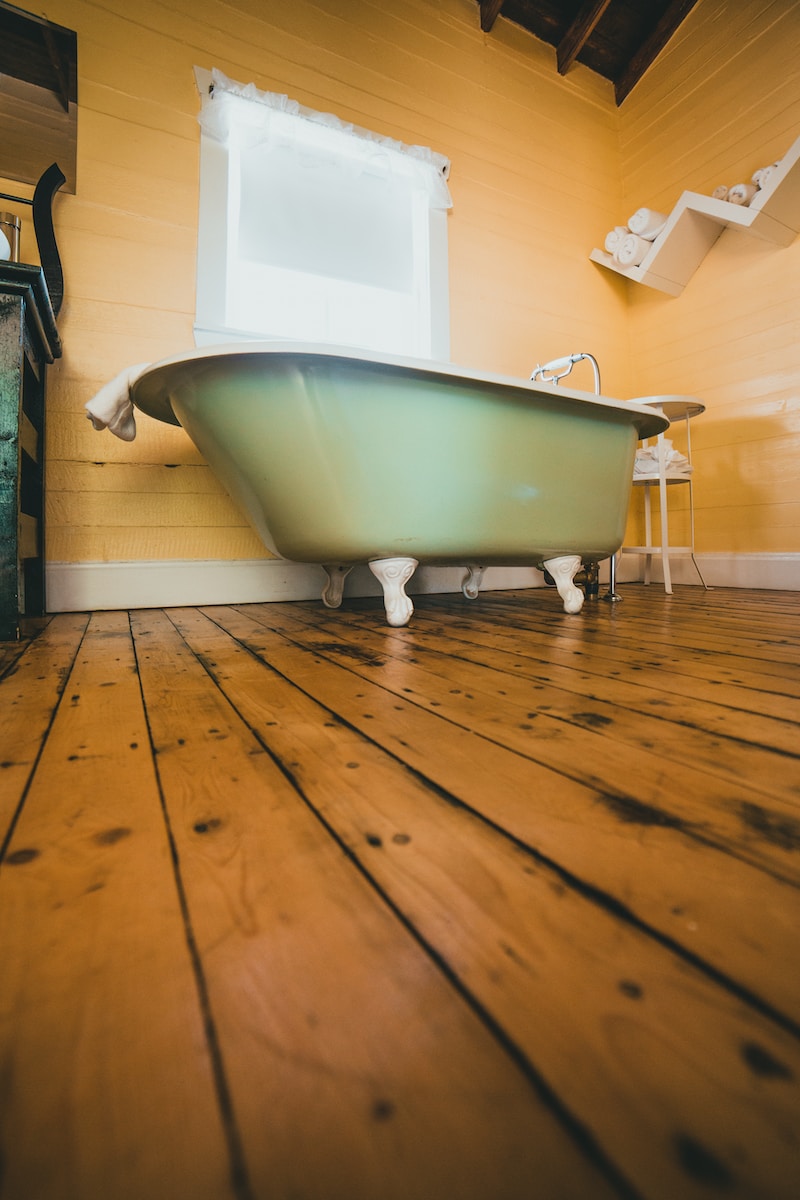 Lazarus Renovation Group: Plumbing. A photo of a green clawfoot tub.